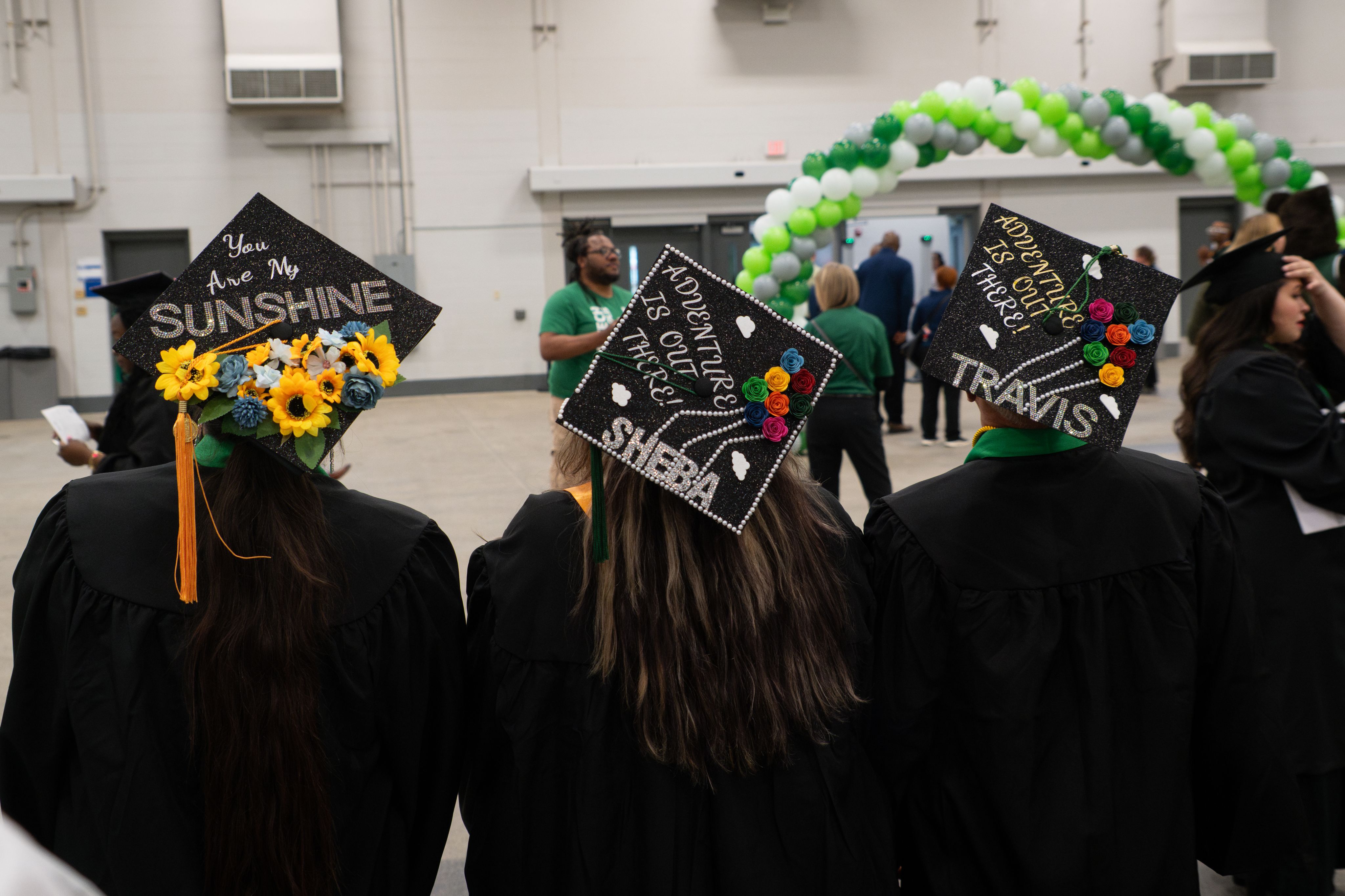 Diverse graduates in caps and gowns during a joyous graduation ceremony, celebrating achievement and success.