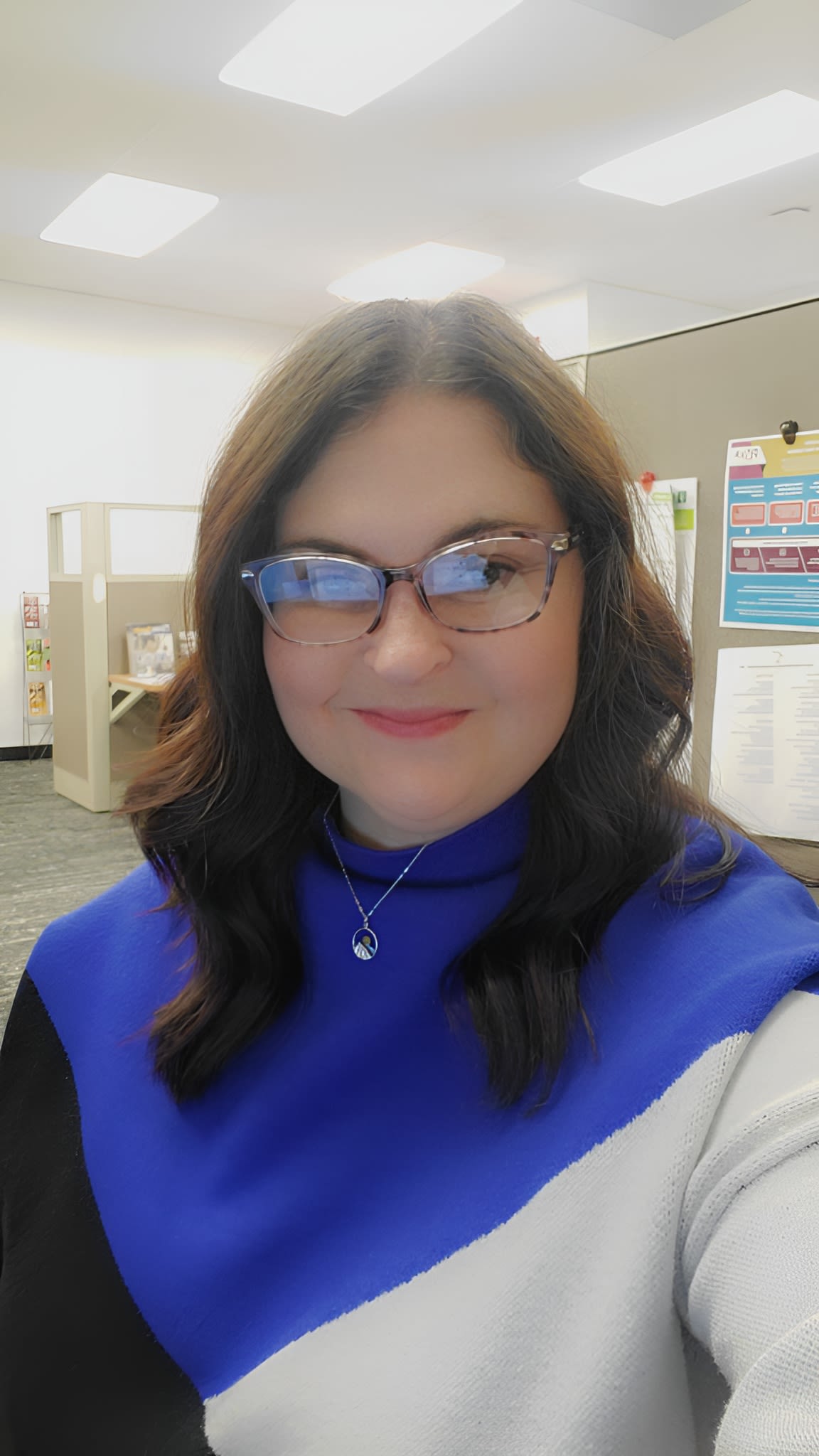 Woman working with documents at office desk