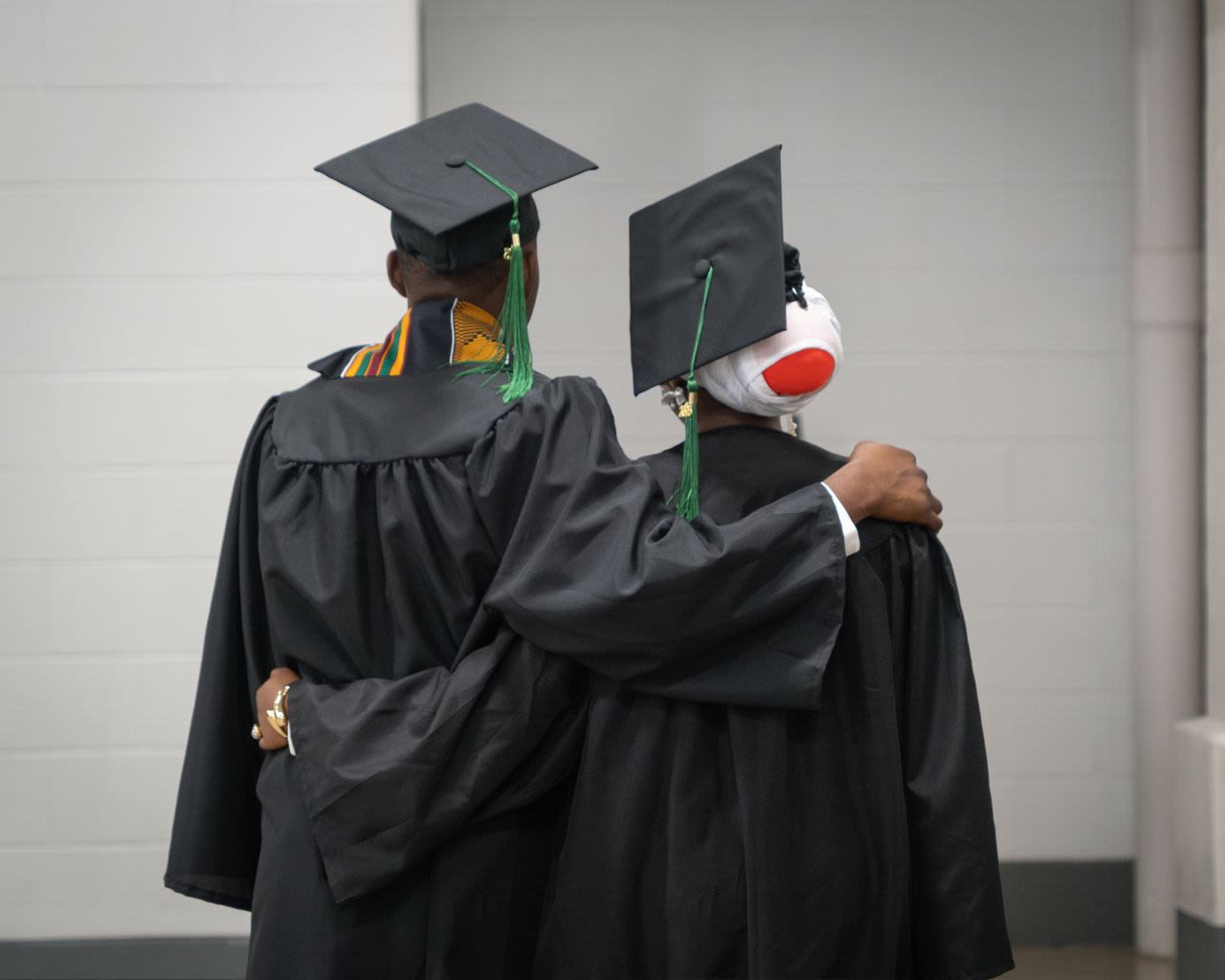a grassy field with a building in the background